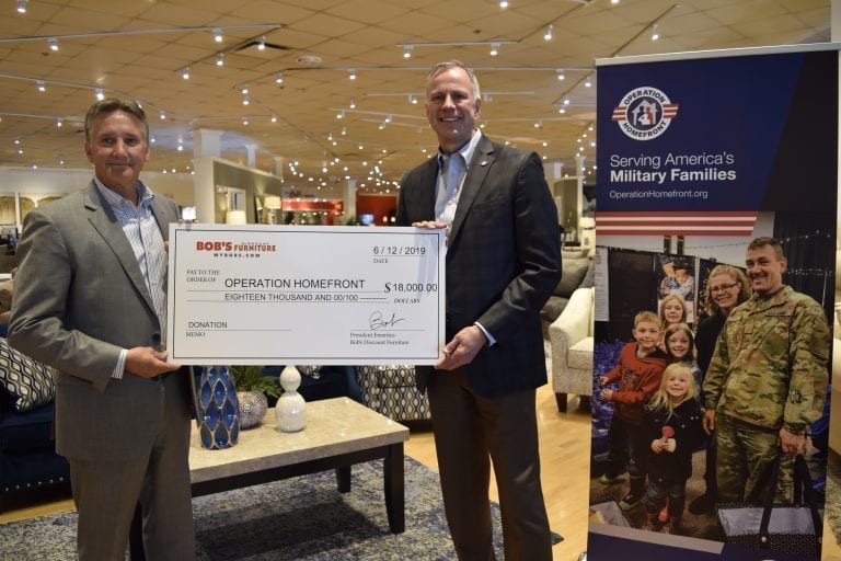 Bob's Discount Furniture presents a check to Operation Homefront.