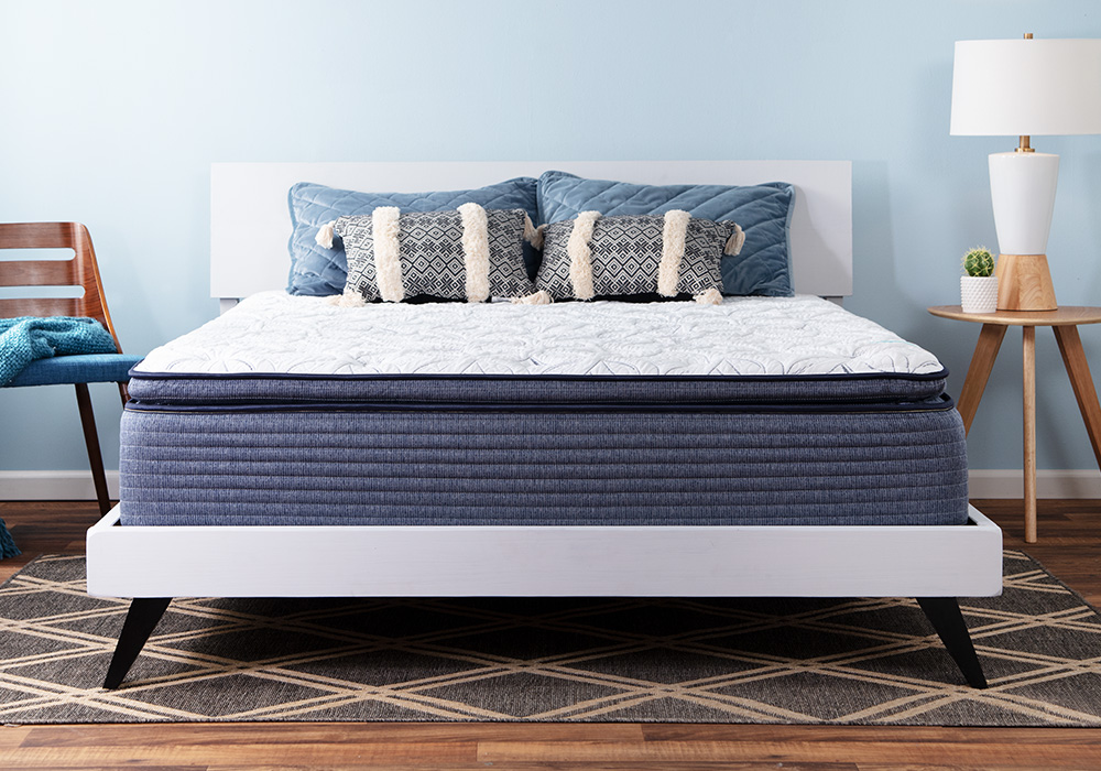 The Stardust Plush Mattress features Bob-O-Pedic Memory Foam, a quilted knit cover and a foam encased individually wrapped coil system | Bob's Discount Furniture