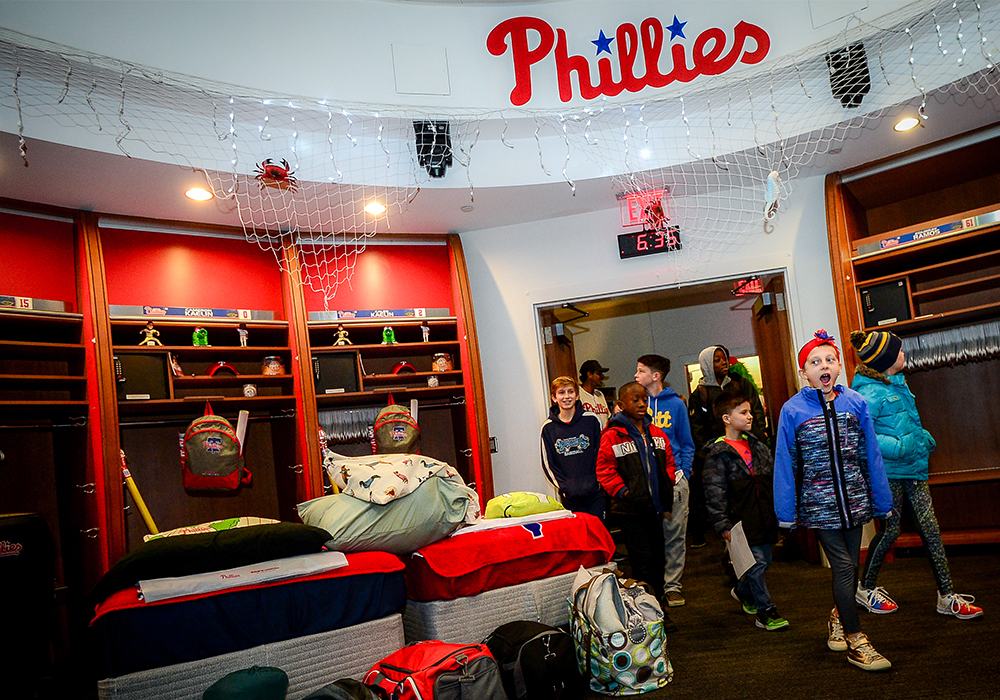 Children walk into the Philadelphia Phillies Clubhouse | Bob's Discount Furniture