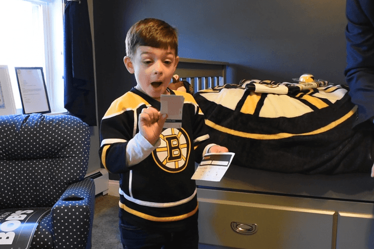 Grant reacts to receiving tickets to a Boston Bruins game.