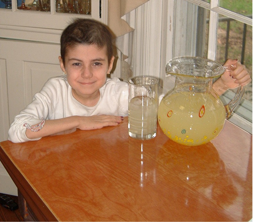 Alex Scott with a pitcher of lemonade.