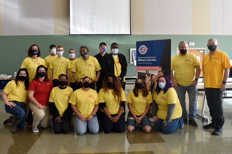 A group of Bob's Discount Furniture employees volunteered at an Operation Homefront Holiday Meals for the Military event.